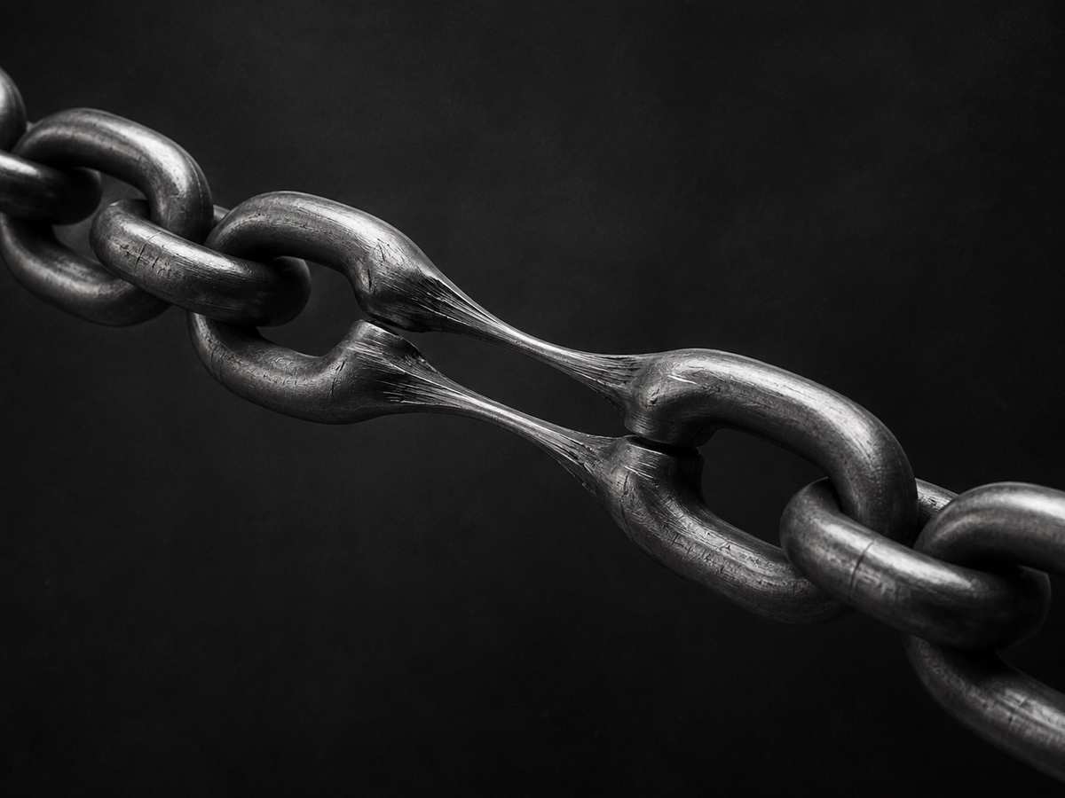 Black and white 3D render of a chain stretched until its links lengthen