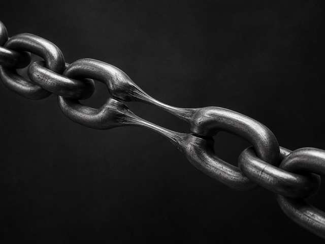 Black and white 3D render of a chain stretched until its links lengthen